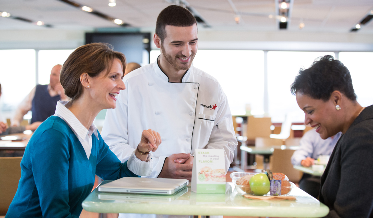 Aramark employee interacts with consumers